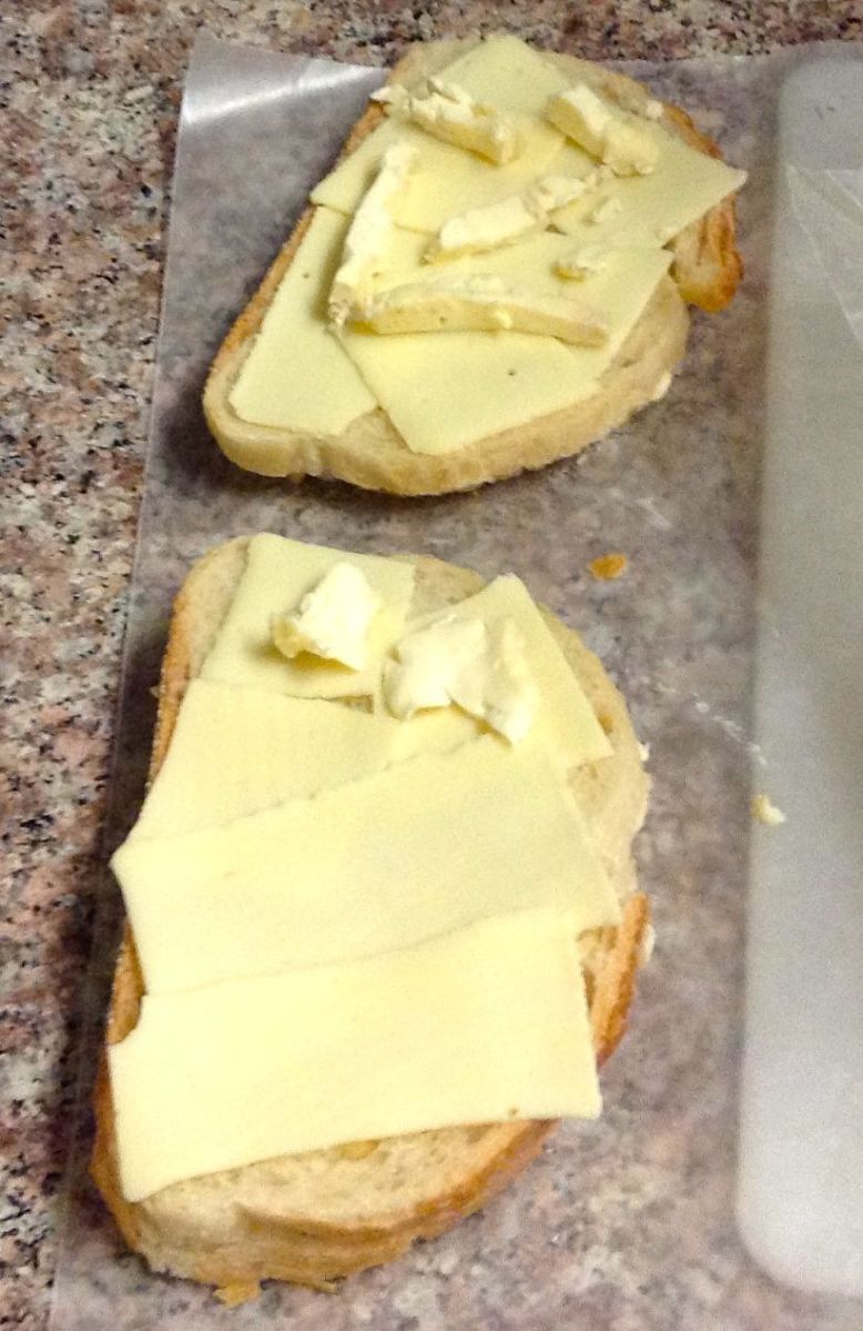 Buttered Italian bread with American cheese and Saint André...