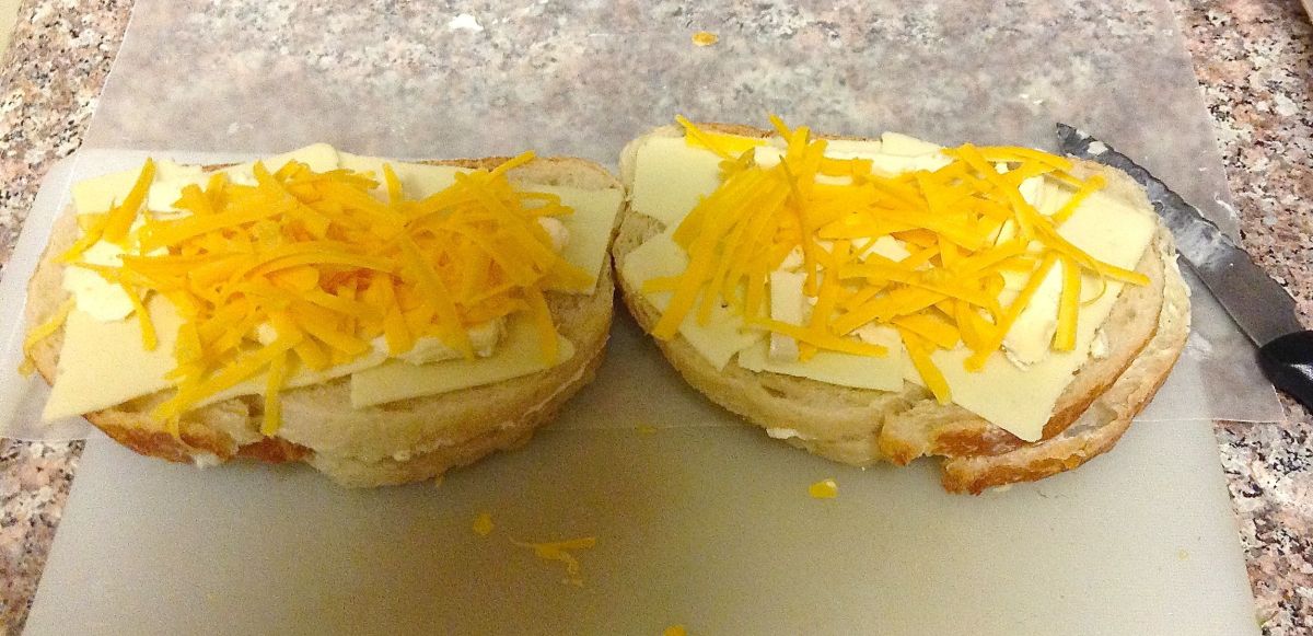 Buttered Italian bread with American cheese, Saint André, and cheddar.