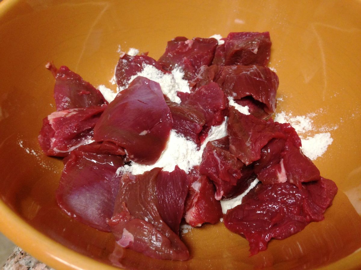 Cube and flour the venison.